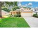 Charming single-Gathering home with a well-manicured lawn and a two-car garage at 3842 Beacon Ridge Way, Clermont, FL 34711
