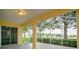 Spacious screened porch overlooking the lush green landscaping at 3842 Beacon Ridge Way, Clermont, FL 34711