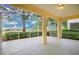Covered, screened in porch with peaceful golf course view at 3842 Beacon Ridge Way, Clermont, FL 34711