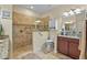 Accessible bathroom with a roll-in shower and grab bars at 3948 Serena Ln, Clermont, FL 34711