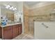 Bathroom with accessible shower and neutral tile at 3948 Serena Ln, Clermont, FL 34711