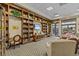 This community library showcases extensive bookshelves, comfy seating, and a television at 3948 Serena Ln, Clermont, FL 34711
