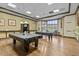 Spacious game room featuring pool tables and lounge area at 3948 Serena Ln, Clermont, FL 34711
