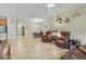 Open living room space leading into dining area, featuring tile floors and neutral walls at 3948 Serena Ln, Clermont, FL 34711