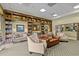 Comfortable lounge with furniture and book shelves at 3948 Serena Ln, Clermont, FL 34711