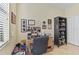 This tidy office space includes a built-in shelf and tile flooring, complemented by a desk by the window at 3948 Serena Ln, Clermont, FL 34711