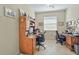 This home office setup features tile flooring, a window for natural light, and dual desk and chair sets at 3948 Serena Ln, Clermont, FL 34711