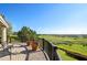 Gorgeous outdoor view from the brick patio overlooking lush landscaping and a distant lake at 3948 Serena Ln, Clermont, FL 34711