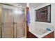 Bathroom featuring a shower, soaking tub and artwork at 41513 Aspen St, Eustis, FL 32736