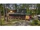 Charming cabin nestled in a wooded area, complete with a screened porch and a peaceful setting at 41513 Aspen St, Eustis, FL 32736