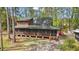 Charming log cabin home with a wrap-around screened porch and mature trees at 41513 Aspen St, Eustis, FL 32736
