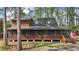 Charming log cabin home with a wrap-around screened porch at 41513 Aspen St, Eustis, FL 32736