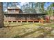 Secluded cabin home featuring a screened porch and mature trees, perfect for nature lovers at 41513 Aspen St, Eustis, FL 32736