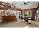Open-concept kitchen with a breakfast bar, stainless steel appliances, and a dining area at 41513 Aspen St, Eustis, FL 32736