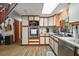 Bright kitchen with white cabinets, stainless steel appliances, and a window over the sink at 41513 Aspen St, Eustis, FL 32736