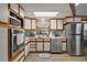 Modern kitchen with stainless steel appliances, white cabinets, and ample counter space at 41513 Aspen St, Eustis, FL 32736