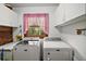 Bright laundry room featuring modern washer and dryer at 41513 Aspen St, Eustis, FL 32736