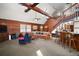 Spacious living room featuring high ceilings, skylights, and wood paneling, creating a cozy atmosphere at 41513 Aspen St, Eustis, FL 32736