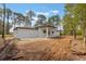 A modern single-story home features a minimalist backyard with a concrete patio, ready for customization at 42191 Cashew St, Eustis, FL 32736