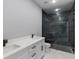 Elegant bathroom with dual sinks, modern fixtures, and a luxurious glass-enclosed shower at 42191 Cashew St, Eustis, FL 32736