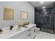 Bathroom featuring double sink vanity with modern fixtures and a glass-enclosed shower at 42191 Cashew St, Eustis, FL 32736