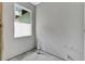 Unfinished bathroom with a bright window allowing natural light to flood the space, with plumbing fixtures in place at 42191 Cashew St, Eustis, FL 32736