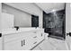 Bathroom featuring double sink vanity with white cabinets and a glass enclosed shower at 42191 Cashew St, Eustis, FL 32736
