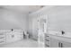 Bright bathroom features dual vanities with modern fixtures and hardware at 42191 Cashew St, Eustis, FL 32736