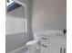 Modern bathroom has a bright window and single sink at 42191 Cashew St, Eustis, FL 32736