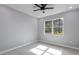 Minimalist bedroom with abundant natural light and a serene, neutral color palette at 42191 Cashew St, Eustis, FL 32736