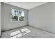 Well-lit bedroom featuring a window with lush greenery, providing a serene atmosphere for relaxation and rest at 42191 Cashew St, Eustis, FL 32736