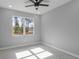 Bedroom features a window with a view at 42191 Cashew St, Eustis, FL 32736