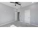 Bright bedroom with ceiling fan and two access doors at 42191 Cashew St, Eustis, FL 32736