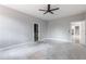 Spacious bedroom featuring a ceiling fan and ensuite bath access at 42191 Cashew St, Eustis, FL 32736