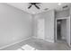 Bedroom features a ceiling fan and direct access to ensuite bathroom at 42191 Cashew St, Eustis, FL 32736
