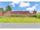 Welcoming brick signage at Royal Trails, a deed-restricted community with lush landscaping and a well-maintained entrance at 42191 Cashew St, Eustis, FL 32736