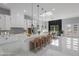 Bright, open kitchen with large island, pendant lighting, and white marble floors at 42191 Cashew St, Eustis, FL 32736