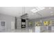 Open-concept living area features white built-ins, abundant natural light, and modern fixtures at 42191 Cashew St, Eustis, FL 32736