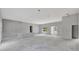 Unfinished living room showing windows and door; ready for finishing touches at 42191 Cashew St, Eustis, FL 32736