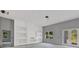 Spacious living room showing built-in shelves and windows for natural light at 42191 Cashew St, Eustis, FL 32736