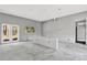 Living room with windows and glass doors providing natural light to the home at 42191 Cashew St, Eustis, FL 32736