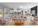 Open-concept living room with white marble flooring, modern furnishings, and abundant natural light at 42191 Cashew St, Eustis, FL 32736