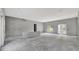 Large living room with windows and door; ready for finishing touches at 42191 Cashew St, Eustis, FL 32736