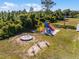 A fun playground area for Royal Trails community, including a slide, merry-go-round, and other play structures at 42191 Cashew St, Eustis, FL 32736