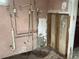 Damaged bathroom features exposed plumbing and unfinished wall, needs renovation at 447 E Desoto St, Clermont, FL 34711