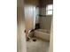 Damaged bathroom with a tub, peeling paint, and missing tiles, needs renovation at 447 E Desoto St, Clermont, FL 34711