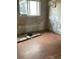 Bedroom in need of repair with peeling paint and debris at 447 E Desoto St, Clermont, FL 34711