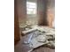 Bedroom with peeling paint, debris and flooring waiting to be installed at 447 E Desoto St, Clermont, FL 34711