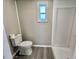Toilet and shower with a window at 519 Hawthorne Blvd, Leesburg, FL 34748