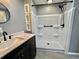 Bathroom features a shower with a black shower head and sink with modern fixtures at 519 Hawthorne Blvd, Leesburg, FL 34748